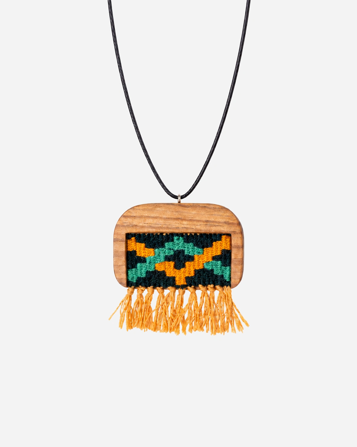 Citrus Zigzag Kilim Necklace with green and mustard weaving, a rounded walnut frame and mustard fringe on a black cord.