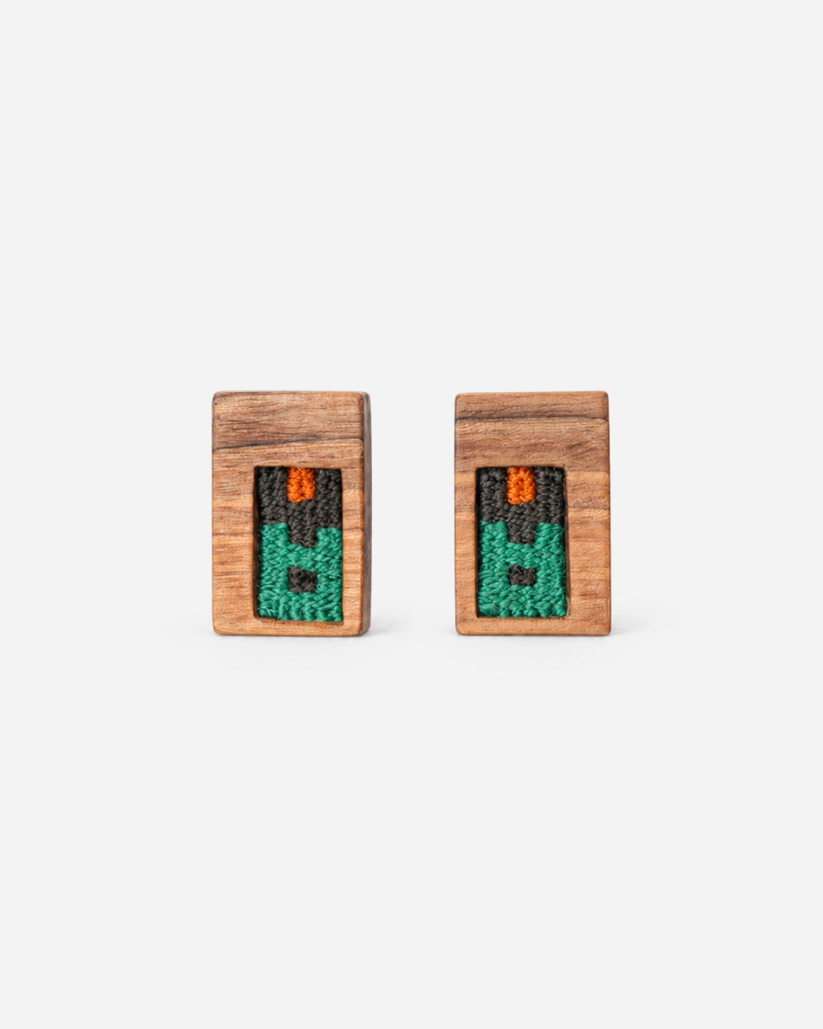 Emerald Frame Kilim Earrings with green, charcoal and orange weaving in rectangular walnut frames.