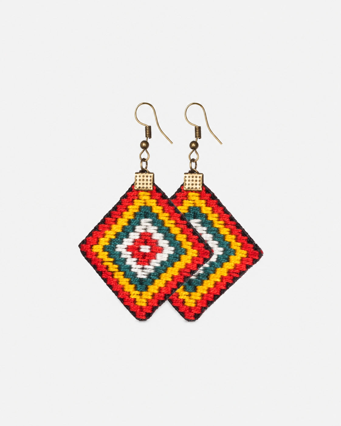 Prism Weave diamond-shaped earrings with a geometric woven pattern in red, yellow, teal and white.