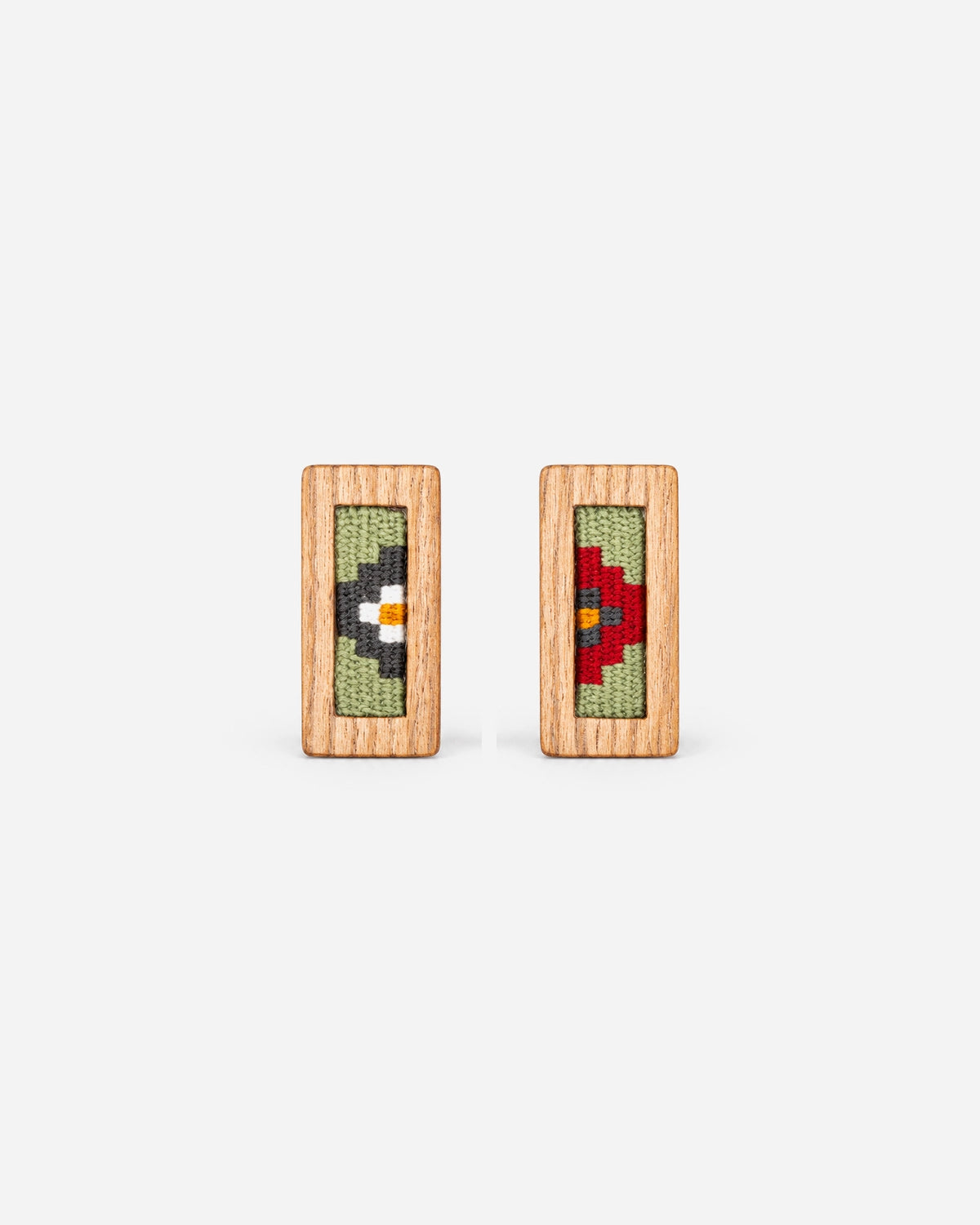 Rose Garden Kilim Earrings with contrasting white and red floral motifs on sage in slim walnut frames.