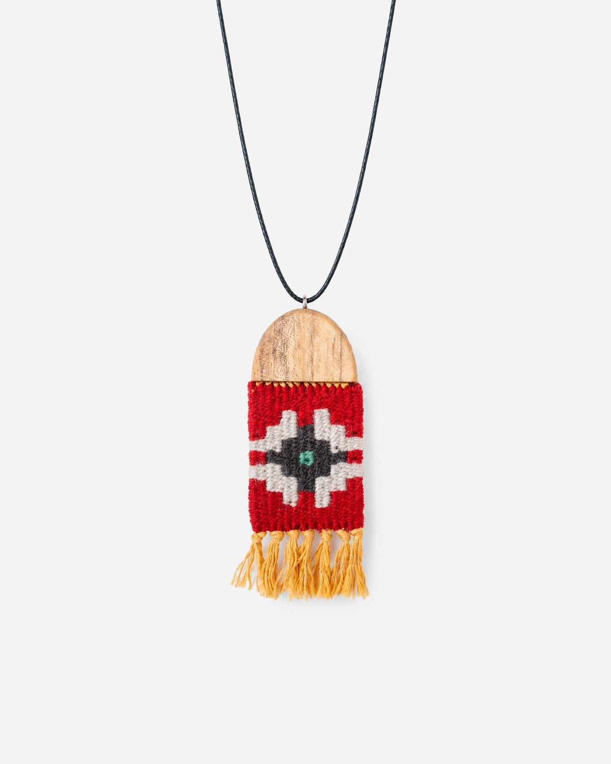 Saffron Dome Kilim Necklace with red geometric weaving, a rounded walnut cap and mustard fringe on a black cord.
